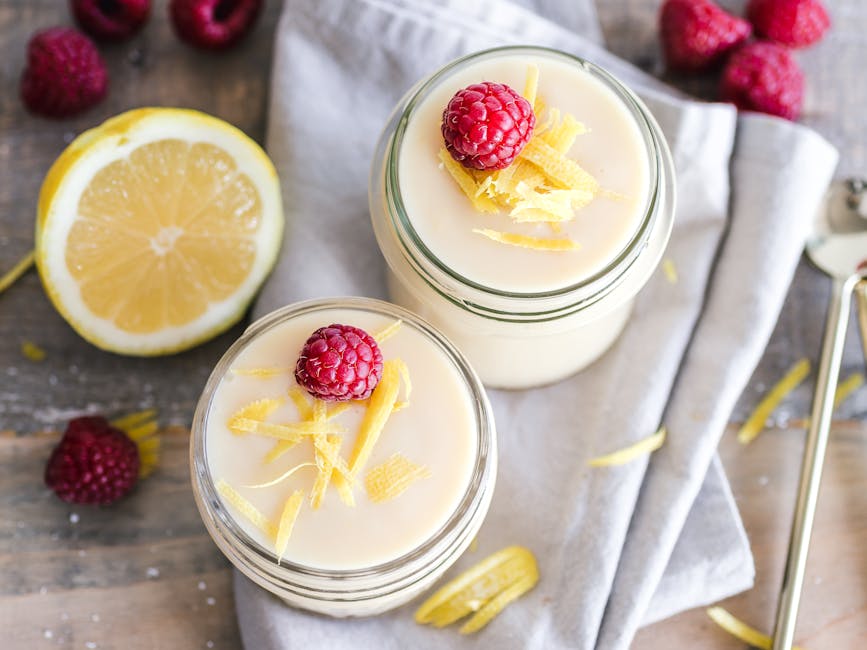 Fresh lemon raspberry yogurt in mason jars, perfect for a refreshing dessert.